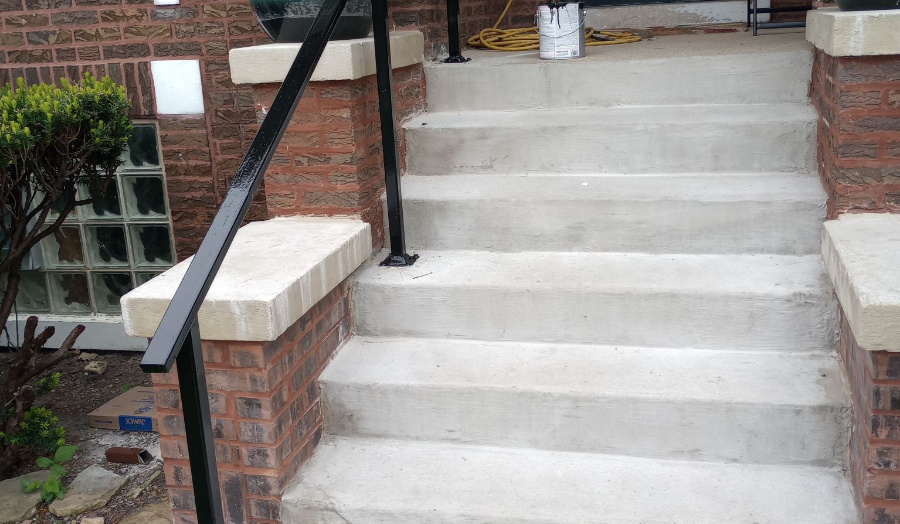 Concrete staircase with iron railing